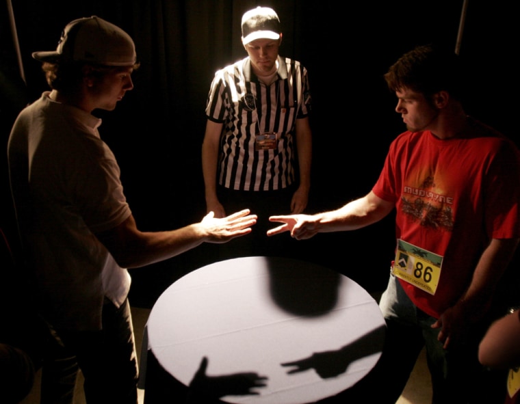 Two contestants compete in the 2006 International World Rock Paper Scissors Championships in Toronto