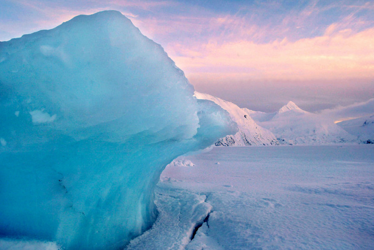 An iceberg from the Portage Glacier is locked in the frozen Portage Lake south of Anchorage, Alaska in this Jan. 6, 2004 file photo. The glacier, which is a major Alaska tourist destination near Anchorage's southern edge, has retreated so far it no longer can be seen from a multimillion-dollar visitors center built in 1986.