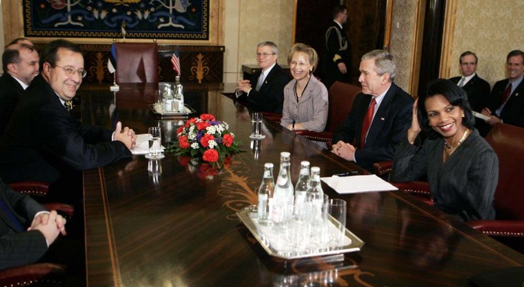 Estonian President Toomas Hendrik Ilves, left, sits across the table from U.S. President George W. Bush, second right, and U.S. Secretary of State Condoleezza Rice, right, before the start of their meeting at Kadriorg Palace, Tuesday, Nov. 28, 2006 in Tallinn, Estonia.