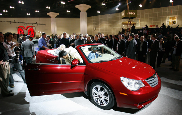A crowd gathers around the 2008 Chrysler Sebring convertible at the Los Angeles Auto Show