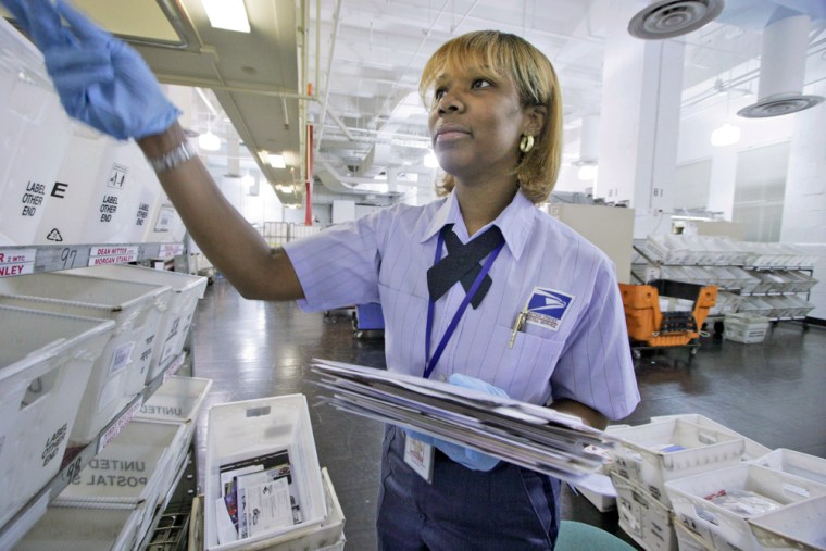 Seprina Jones-Sims sorts mail that is addressed to the non-existent World Trade Center Towers on Nov. 28 in New York. 
