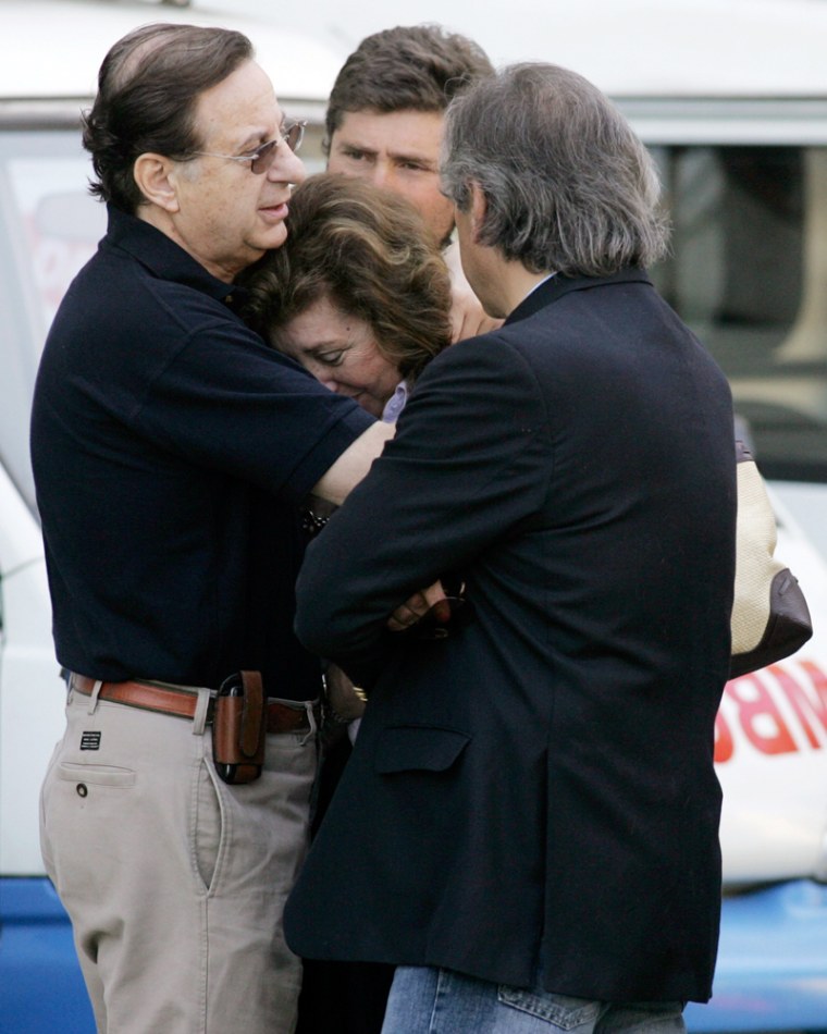 Lucia Pinochet Hiriart, daughter of former Chilean dictator Pinochet , is consoled after visiting her father at Chile's Military Hospital in Santiago
