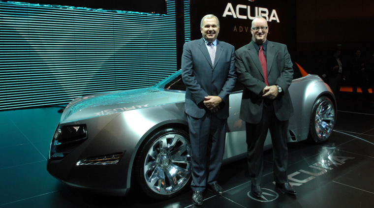 Honda Americas’ chief designer Dave Marek, right, and senior vice president John Mendel show off the Acura Advanced Sedan at the Los Angeles Auto Show.