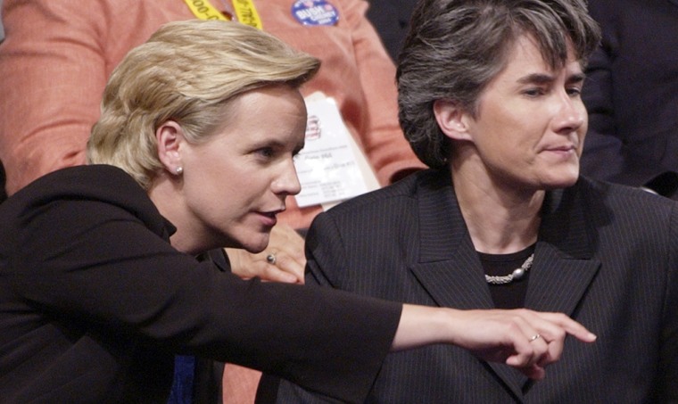 Mary Cheney, left, daughter of Vice President Dick Cheney, sits with her partner, Heather Poe, in Madison Square Garden during the Republican National Convention in New York on Sept. 1, 2004.