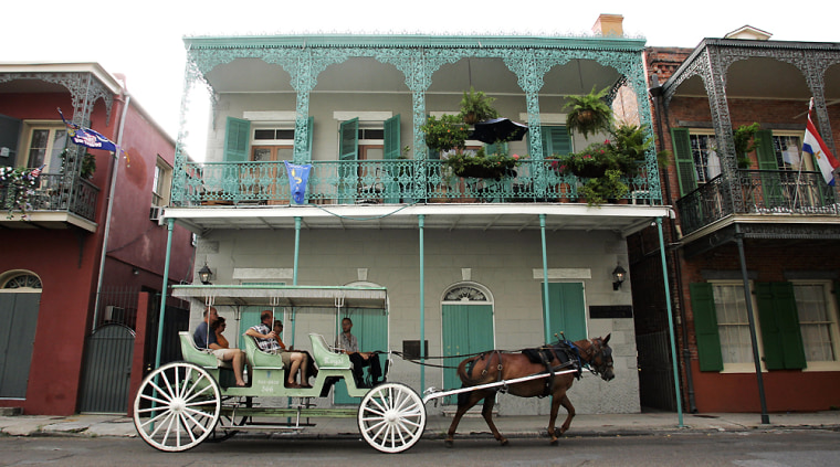 Tourists enjoy a carriage ride along Charters Street in the French Quarter, in this July 26, 2006, file photo in New Orleans. 