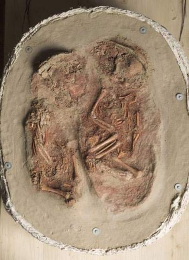 Fossils of buried infant twins decorated with beads and red ochre, dated to 27,000 years ago, suggest they were considered equal members of society.