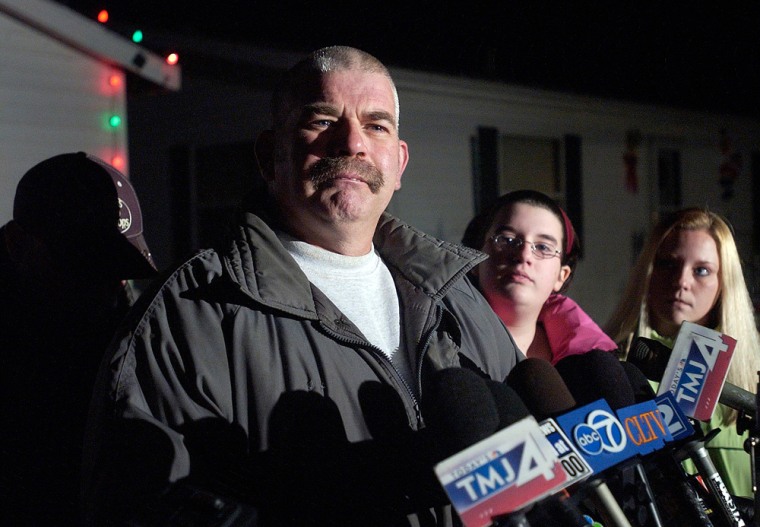 Ken Hutchison speaks to reporters Tuesday during a press conference outside his home in Trevor, Wis. James Ealy is charged with killing Mary Hutchison, Ken Hutchison's wife, during a Nov. 27 robbery. 