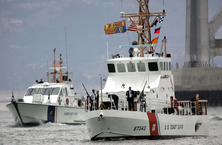 The Coast Guard cutter Tern (R) crosses the Oakland Bay in San Francisco, CA.  