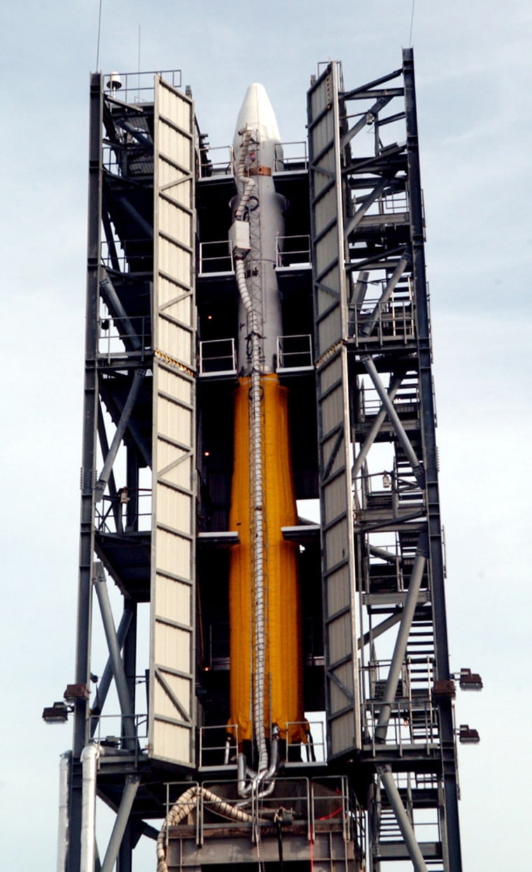 The Minotaur I rocket, carrying a small experimental satellite for the Air Force and an even smaller one for NASA, sits on the launch pad at the Mid-Atlantic Regional Spaceport on Wallops Island, Va., Nov. 28, 2006. The 70,000-pound rocket is scheduled to blast off Monday, Dec. 11, 2006, from Virginia's rural Eastern Shore. (AP Photo/The Virginian-Pilot, Steve Earley) ** MAGS OUT, INTERNET OUT **