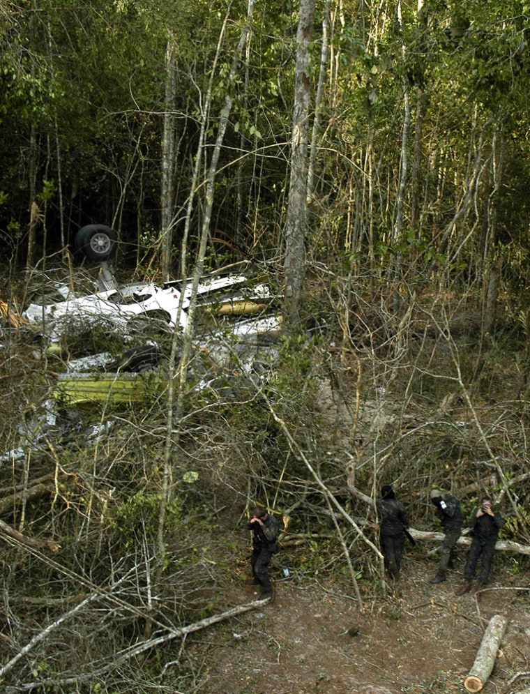 Rescuers search for clues in October in the Amazon jungle after two planes collided Sept. 29, killing 154 people.