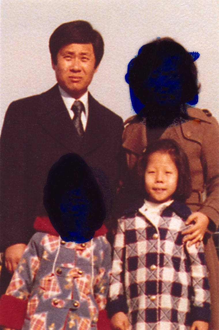 Han Tak Lee and his wife, Esther Lee, pose with their two daughters in South Korea in this family photo from the mid-1970s. Lee is appealing his life sentence for a Pennsylvania fire that took the life of his oldest daughter, Ji Yun Lee, foreground right. His wife and their surviving daughter, who are adamant that Lee is innocent, did not want their faces shown because of the stigma they feel from Lee being imprisoned.