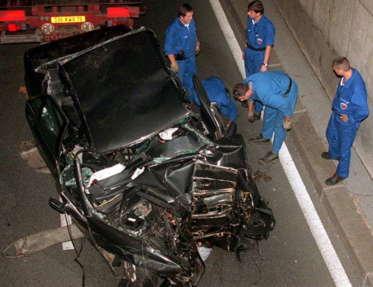 Paris police officers inspect the scene of the accident in which Princess Diana was killed on Aug. 31, 1997.