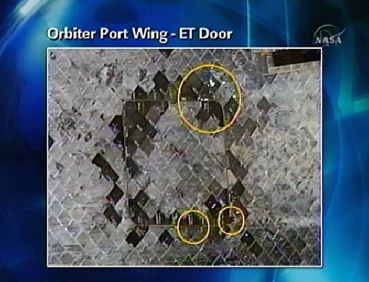 In this image from television shown Monday, Dec. 11, 2006 during a mission status briefing,  space shuttle Discovery tiles are highlighted in a photograph. NASA plans to study the tiles for possible damage.