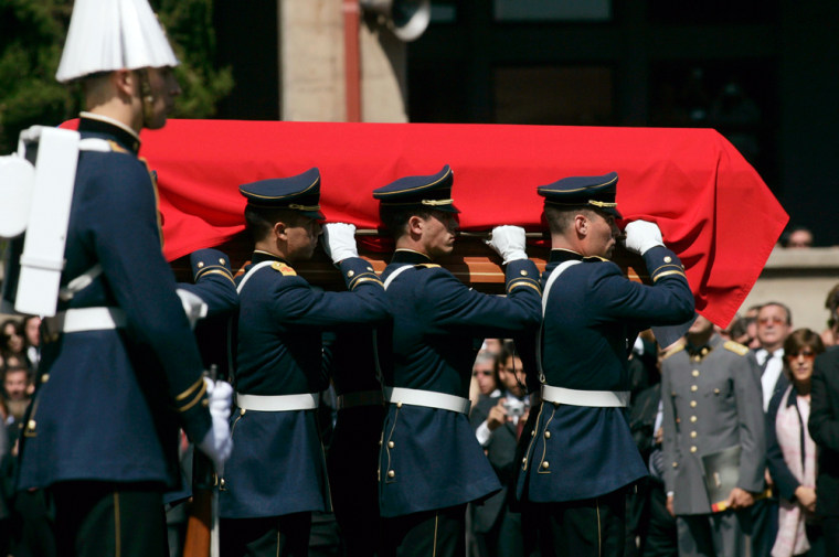 The coffin of former Chilean dictator Augusto Pinochet is carried into the courtyard of the Military College for the funeral mass, in Santiago