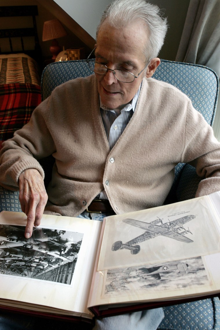 Warren Ludlum, 83, sits in his Old Tappan, N.J., home as he looks through his scrapbook of B-24 bomber memorabilia Friday. A bomber pilot in World War II, Ludlum says he was shot down while being escorted by Tuskegee Airmen.