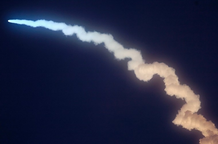 Carrying two experimental satellites, the Minotaur I rocket streaks across the sky after Saturday's liftoff from the Mid-Atlantic Regional Spaceport in Atlantic, Va.
