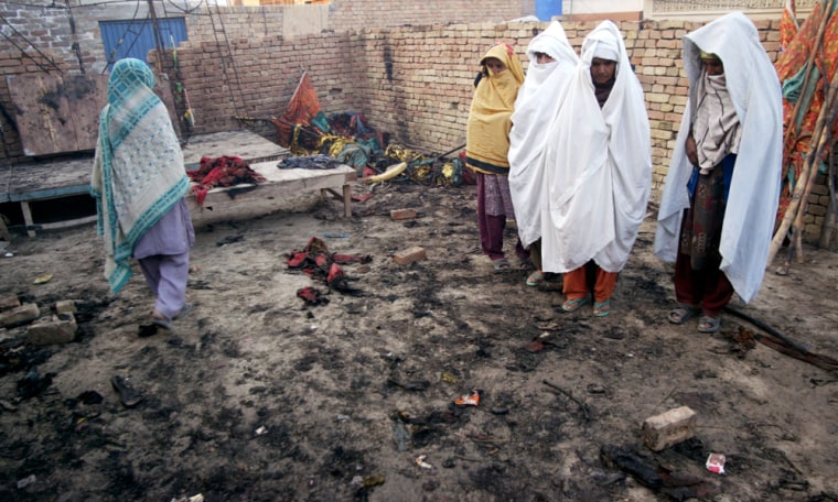 Residents visit the site of a fire and stampede incident near Multan