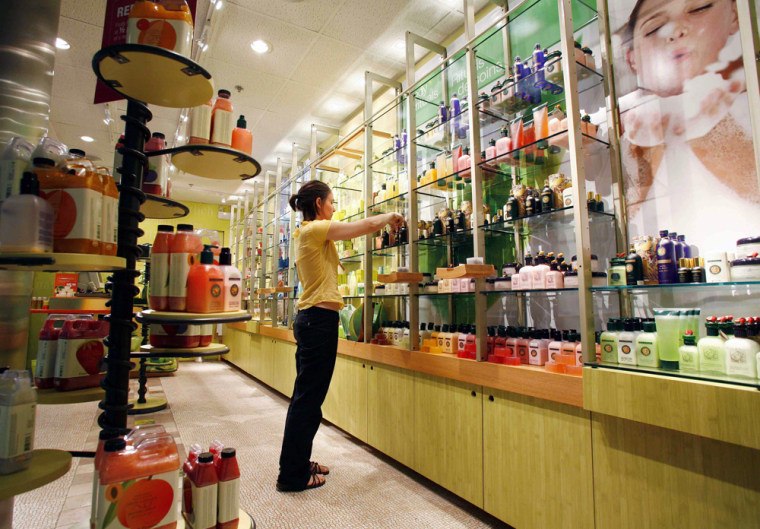 Meleta Smith cleans shelves at Fruits & Passion body and bath store in Calgary's International airport