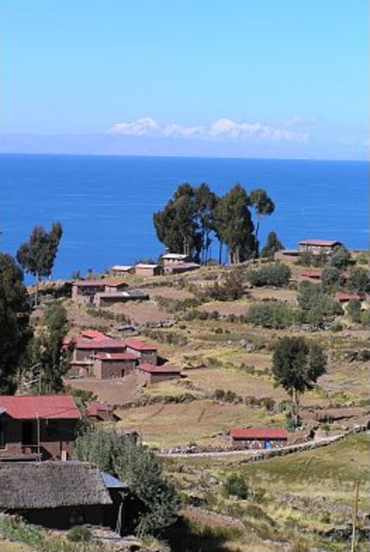 Mountains in neighboring Bolivia are seen from a high point on the island of Taquile, near Puno, Peru.