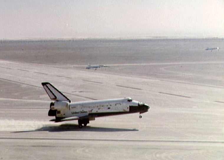 The shuttle Columbia touches down on the Northrop Strip at White Sands in New Mexico on March 30, 1982, trailing gypsum powder behind it.