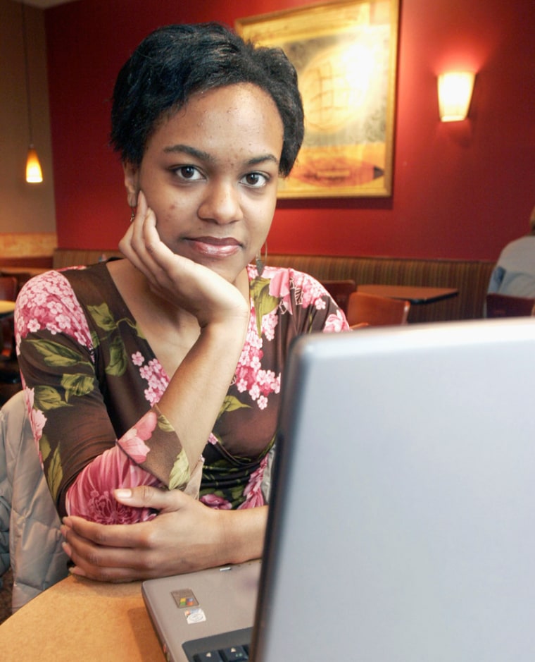 Melissa Bush, a business major at the University of Dayton, is seen with her laptop at a restaurant in Cincinnati. Bush thinks that it is an invasion of privacy when employers use social online sites such as Facebook, MySpace, and YouTube in their hiring decisions. 