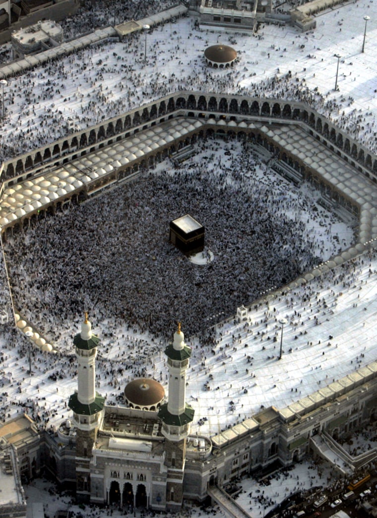 An aerial view shows the Grand Mosque as tens of thousands of Muslim pilgrims move around the Kaaba, the black cube seen at center inside, in Mecca, Saudi Arabia, on Sunday.