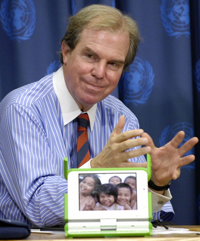 Negroponte, Professor and Chairman Emeritus of the Massachusetts Institute of Technology, shows model of laptop computer he developed in New York
