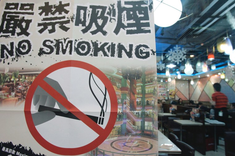 A poster promoting the new anti-smoking law is shown at a restaurant in Hong Kong