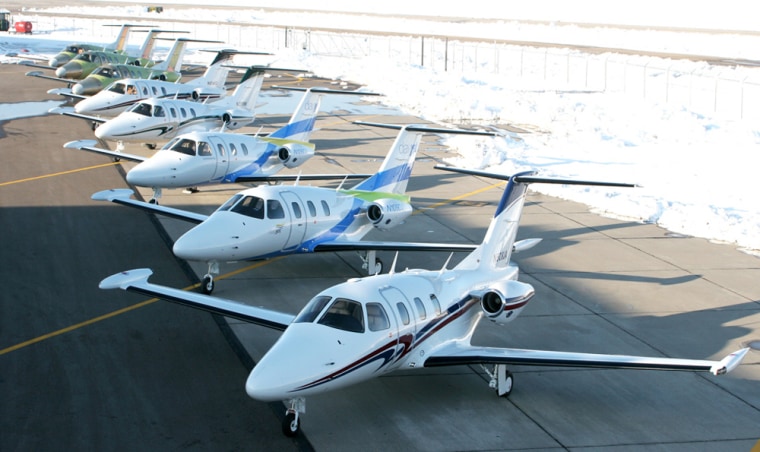 In this photo provided by Eclipse Aviation, eight Eclipse 500 aircraft are shown last month in Albuquerque, N.M. The first customer aircraft was delivered to co-owners David Crowe, a private owner, and Jet-Alliance, a shared jet ownership company in Westlake Village, Calif. 