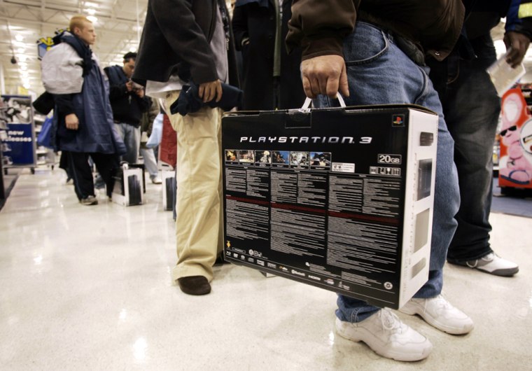 Patrons hold their Sony PlayStation 3 gaming consoles in Duluth
