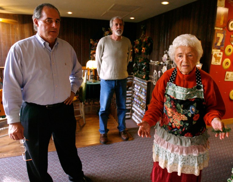 Marie Kolasinski, right, founder of the Piecemakers, a small religious sect that runs a country store, attorney Joe Donahue, left, and Doug Follette, discuss problems the group has had with health inspectors in November in Costa Mesa, Calif.