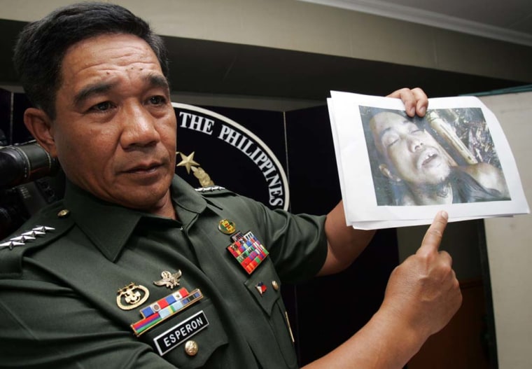 Philippine Armed Forces Chief Gen. Hermogenes Esperon Jr. shows a photo taken of killed Abu Sayyaf leader Jainal Antel Sali Jr., also known as Abu Sulaiman, during a news conference at their headquarters in Quezon city, Philippines, on Wednesday.