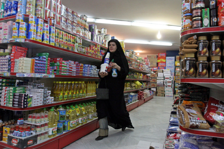 A woman shops in a northern Tehran supermarket on Wednesday. Prices for everything from vegetables to housing have skyrocketed in Iran in recent months.