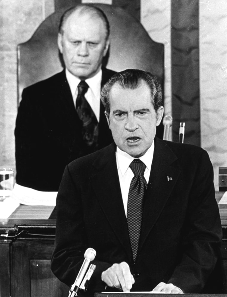 *** FILE *** This picture, with Gerald Ford seated behind him, shows President Richard Nixon delivering a State of the Union message before a joint session of Congress in Washington in January, 1974. Gerald R. Ford, who picked up the pieces of Richard Nixon's scandal-shattered White House as the 38th and only unelected president in America's history, has died, his wife, Betty, said Tuesday Dec. 26, 2006. He was 93.  (AP Photo)