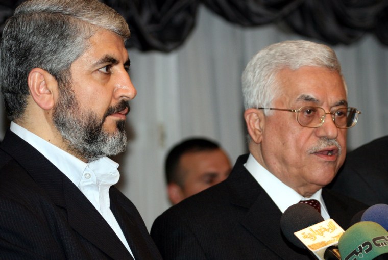 Palestinian president Mahmoud Abbas, right, and Khaled Mashaal, political leader of Hamas talk to reporters at a Sunday press conference in Damascus, Syria.
