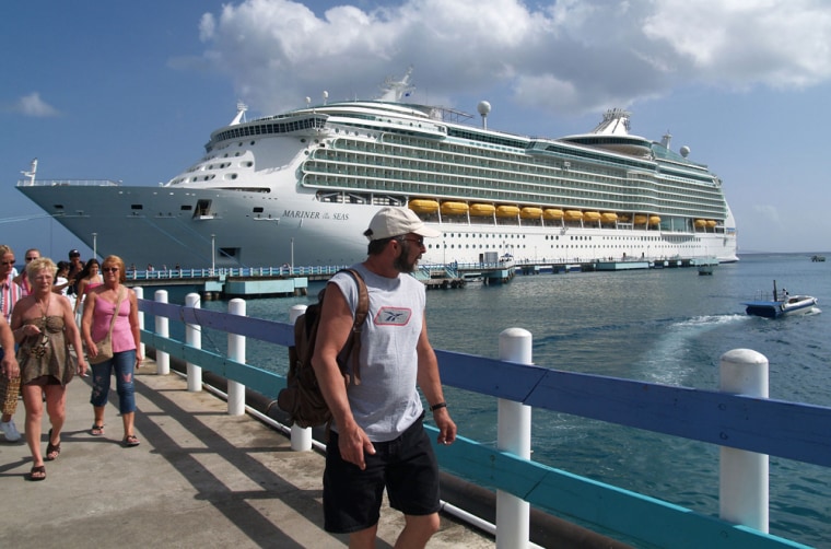Mariner of the Seas passenger Chuck Robinson of Sioux Falls, S.D., center, walks ashore from the pier at Ocho Rios, Jamaica. Active travelers will find no shortage of shore experiences on cruise ships to whet their appetite for adventure.