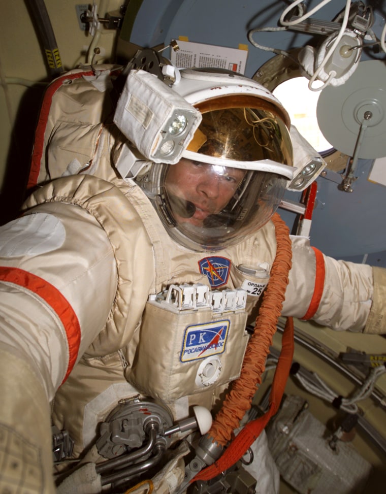 NASA astronaut Michael Lopez-Alegria wears a Russian spacesuit during a test on the international space station. He'll use the suit during a key outing Feb. 22.