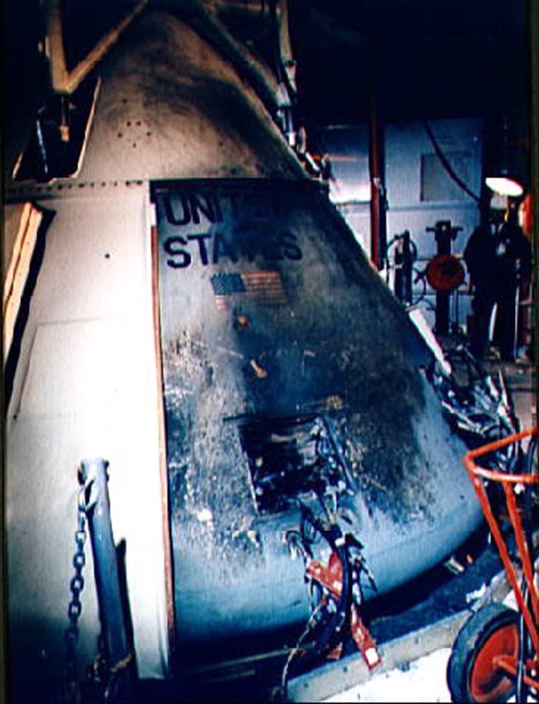 A closeup view of the exterior of Apollo 012 Command Module at Pad 34 showing the effects of the intense heat of the flash fire which killed the prime crew of the Apollo 1 mission. Astronauts Virgil I. Grissom, Edward H. White II, and Roger B. Chaffee lost their lives in the accidental fire.