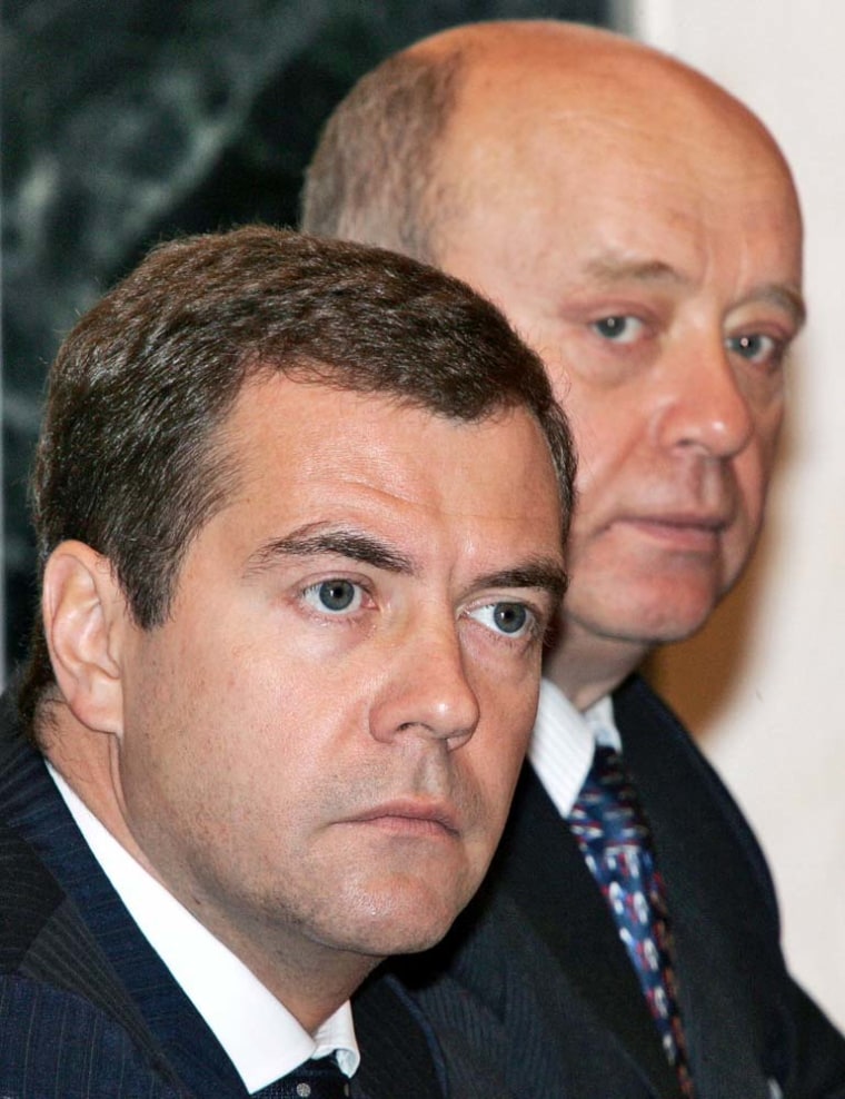 First Deputy Prime Minister Dmitri Medvedev (L) and Russian Prime Minister Mikhail Fradkov attend a government session chaired by the President Vladimir Putin in Moscow's Kremlin, 23 October 2006. 