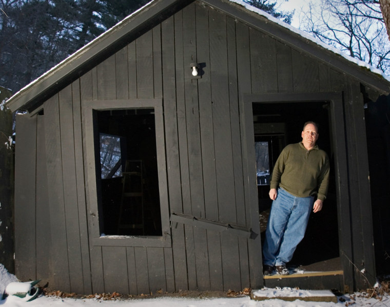Bill Carney stands in a doorway at the Wonder Spot Jan. 18, 2007, in Lake Delton, Wis. Carney has sold the iconic tourist attraction to the village of Lake Delton for $300,000. The village wants to build a road through the crevice where the Wonder Spot has stood since the 1950s. (AP Photo/Morry Gash)