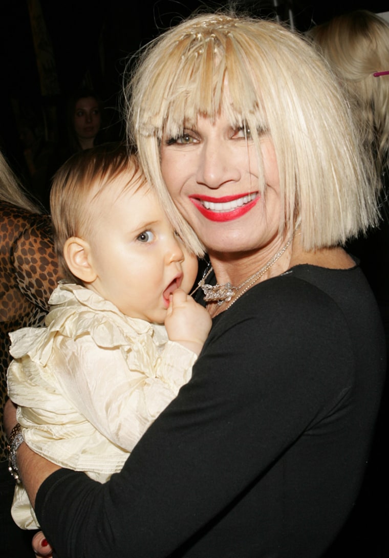 ** CORRECTS DAY TO TUESDAY ** Designer Betsey Johnson holds her granddaughter Layla backstage at the Betsey Johnson show during Fashion Week, Tuesday, Feb. 6, 2007 in New York. (AP Photo/Dima Gavrysh)