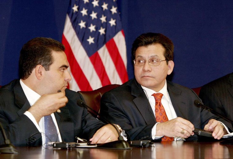 El Salvador's President Elias Antonio Sac, left, and U.S. Attorney General Alberto Gonzales are shown during a press conference after a meeting in San Salvador in which they announced new collaborative efforts to combat transnational gangs.