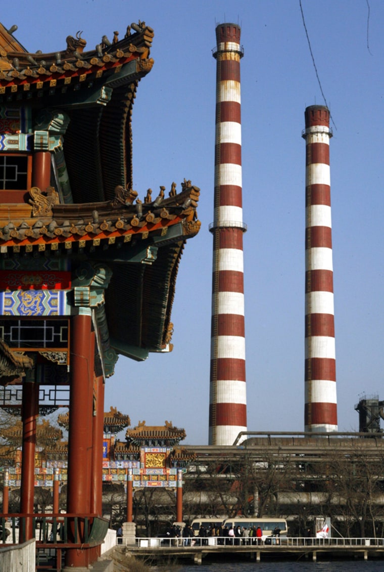 Journalists visit a lake during a media tour at Shougang Iron and Steel Group plant in Beijing