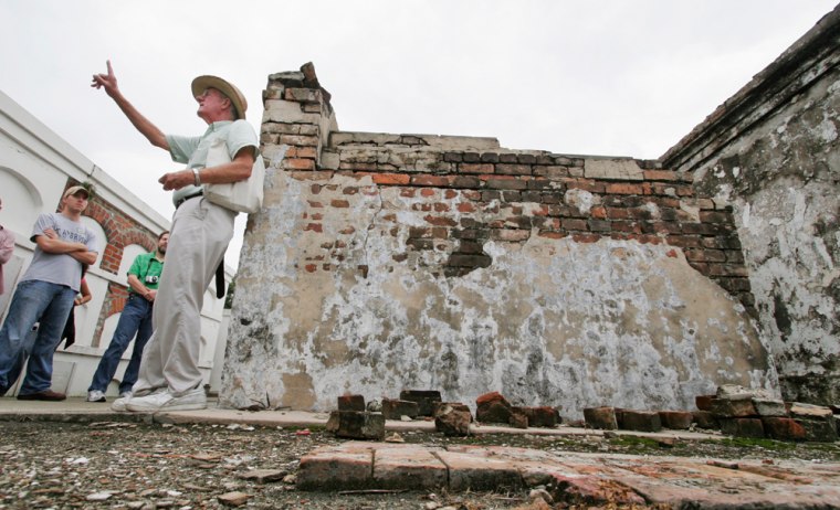 Midge Jones stands next to a tomb as he gives a Haunted History tour of St. Louis Cemetery No. 1 in New Orleans, La.