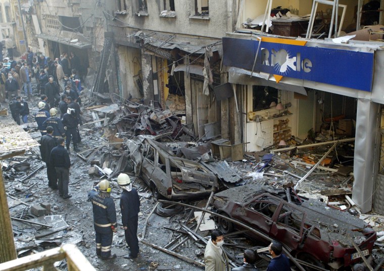 Burned vehicles are seen after an explosion outside the Neve Shalom Synagogue in Istanbul, Turkey, on Nov. 15, 2003. The blast was one of four truck bombings in Istanbul that month that were linked to al-Qaida.