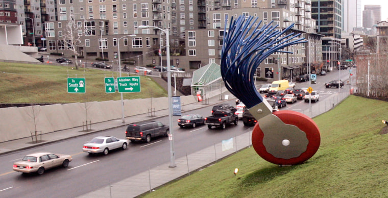 The 19-foot tall "Typewriter Eraser, Scale X," by Claes Oldenburg and Coosje van Bruggen stands in view of traffic passing on nearby Elliott Avenue at the Seattle Art Museum's new sculpture park.