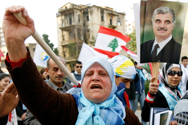A woman chants slogans in support of assassinated former Prime Minister Rafik al-Hariri during a mass rally in Beirut