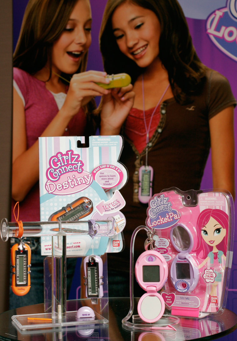 Girlz Connect's Destiny, left, and Girlz Connect Locket Pal are displayed in the Bandai America showroom Monday, Feb. 12, 2007 at the American International Toy Fair in New York. As kids keep getting plugged into the Internet, toy makers are following them online. (AP Photo/Mark Lennihan)