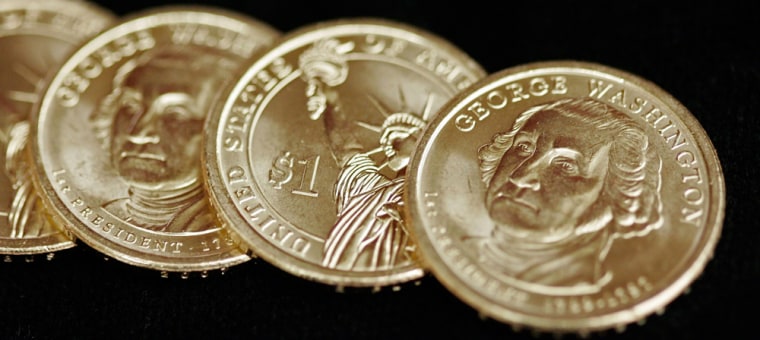 The new presidential $1 coin features George Washington on one side and the Statue of Liberty on the other. It goes into circulation on Thursday, and the U.S. Mint says it will release four coins a year, each featuring a different president.