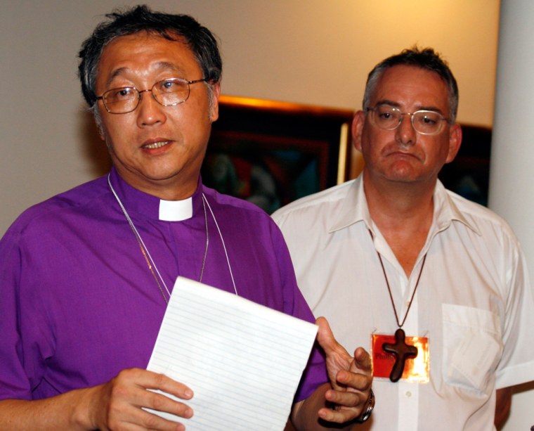 Archbishop of South East Asia Chew and Archbishop of Australia Aspinall attend a news conference during the summit of Anglican primates in Dar es Salaam